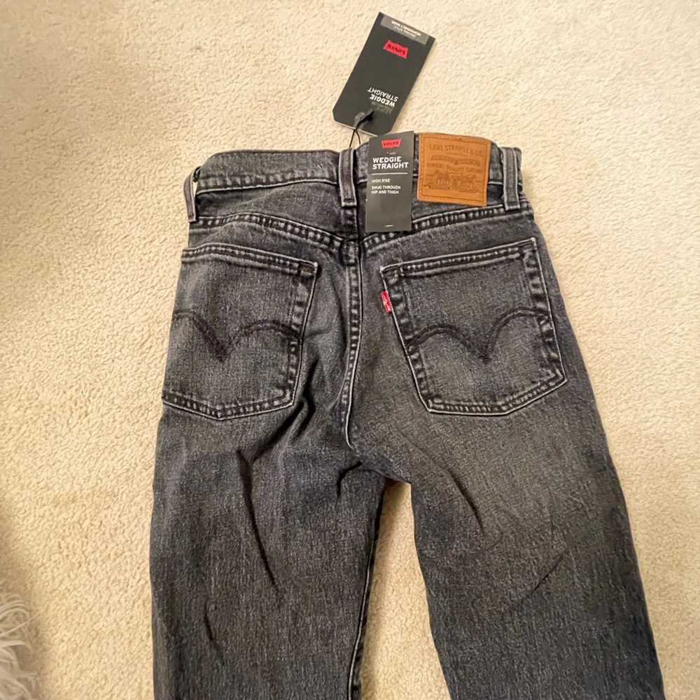 Brand new, never worn straight leg, no rip, black Levi jeans